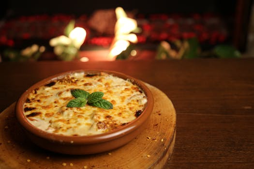 Close-up of a baked lasagna dish with fresh garnish in a cozy, rustic setting.